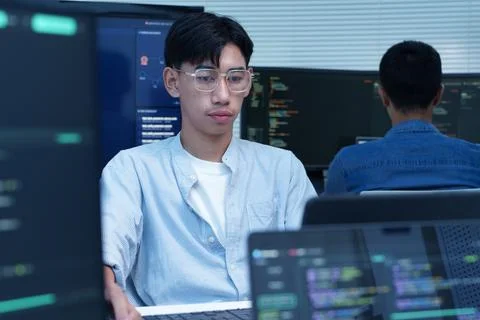 Young Programmer Working on Digital Code 库存照片