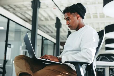 Young programmer working on a new code in a modern office Stock Photos