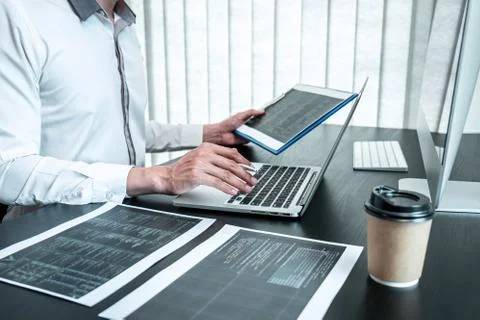 Young Programmer working in software javascript computer in IT office, Writin Stock Photos