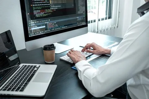 Young Programmer working in software javascript computer in IT office, Writin Stock Photos