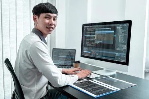 Young Programmer working in software javascript computer in IT office, Writin Stock Photos