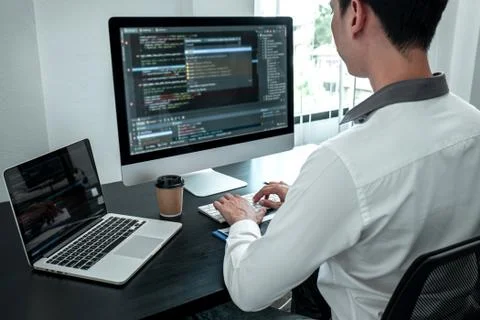 Young Programmer working in software javascript computer in IT office, Writin Stock Photos