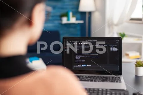 Young programmer writing virtual program code for software development ...