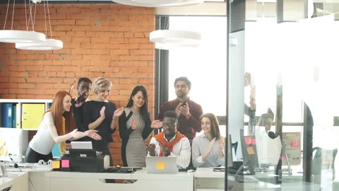 Young programmers are gathered together and having a pleasant conversation at Stock Footage 89924344