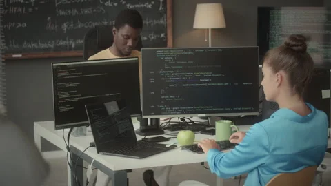 Young Programmers Coding on Computers at Work in Office Stock Footage 263701695