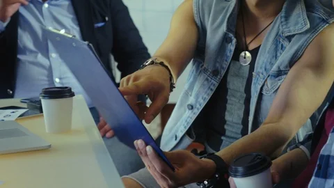 Young programmers discuss the project on is created designed on paper. Stock Footage 90471641