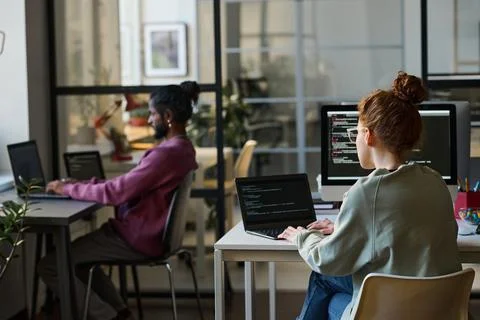 Young programmers working on computers Stock-Fotos