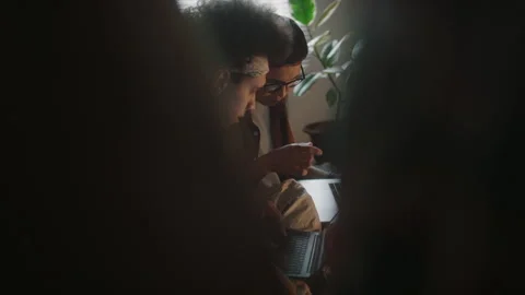 Young Programmers Writing Code while Working on Laptops Together Stock Footage 290869961