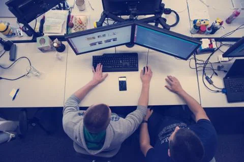 Young programmers writing programming code top view Foto stock