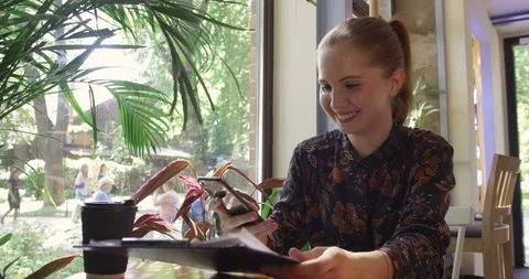 Young project manager in a cafe Stock Footage 112145410