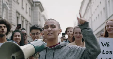 Young protesters protesting on the street Stock Footage 132407120