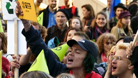 Young protestor screaming in the street Stock Footage 120007497
