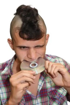 Young punk and CD. Stock Photos