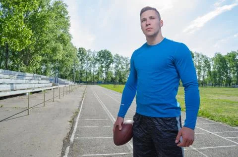 A young quarterback with a ball Stock Photos