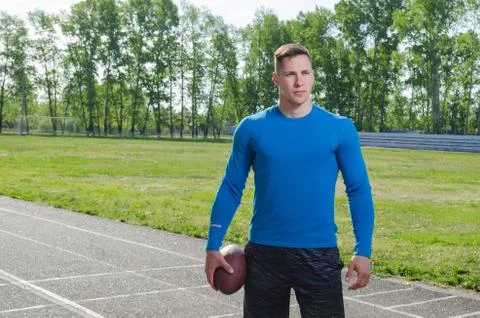 Young quarterback with the ball in training Stock Photos