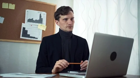 Young realtor having video call with customer using laptop computer Stock-Footage 79900079