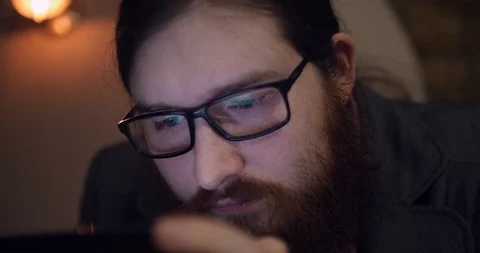 A young red-bearded man using smartphone closeup Stock Footage 87323673