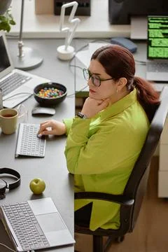 Young Red-Haired Software Engineer Writing Code at Work Stock Photos