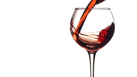 Young red or rose wine pouring into glass white background close up. Right side Stock Footage 143563408