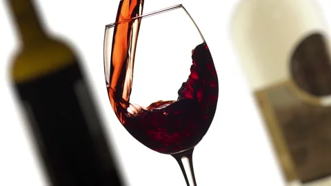 Young red or rose wine pouring into glass angle close up shot Stock Footage 144569494
