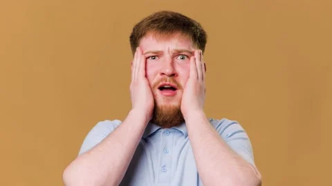 This young redhead guy looks shocked and amazed Stock Footage 234690280