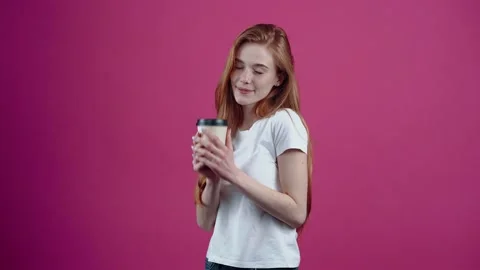 The young redhead with the white helmet of an engineer smiles optimistically and Stock Footage 153977122