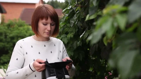 Young redhead woman using VR-helmet for smart phones. Augmented reality Stock Footage 66729547