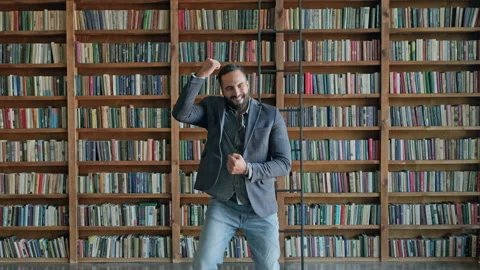 Young Rejoices In The Library. Stock-Footage 140222150