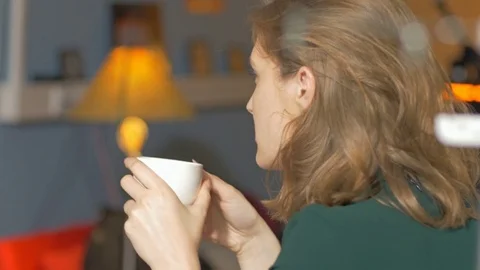 Young relaxed worker drinking coffee and listening about design project. Stock Footage 80470643