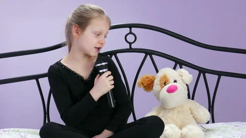 The Young Reporter Interviews With Her Plush Dog Stock Footage 90476739