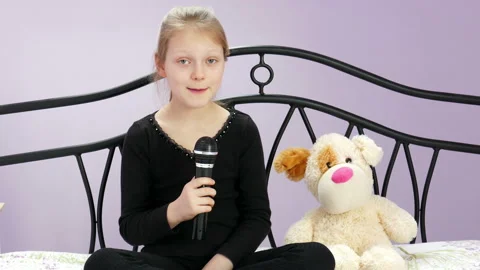 The Young Reporter Interviews With Her Plush Dog 03 Stock Footage 90981629