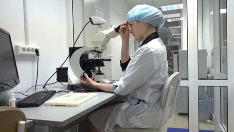 Young Researcher Using Microscope Stock Footage 69841768
