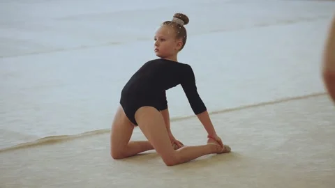 A young rhythmic gymnastics athlete Stock Footage 307290720