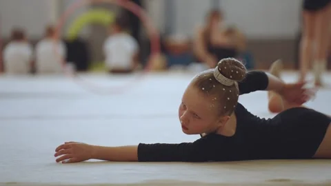 A young rhythmic gymnastics athlete Stock Footage 307290733
