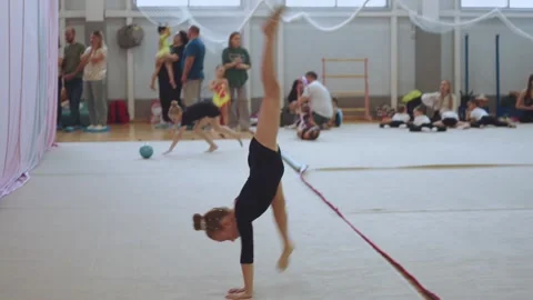A young rhythmic gymnastics athlete Stock Footage 307290751