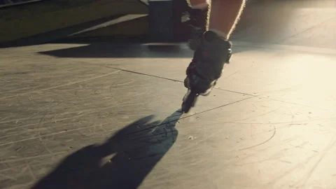 Young roller skater practicing stunt at skate park. Man legs in roller skates. Stock Footage 171299271