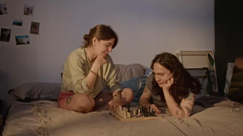 Young Romantic Couple Playing Chess Board Game at Home 스톡 동영상 345210393