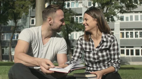 Young romantic couple spending time in park and reading book. 動画素材 55078220