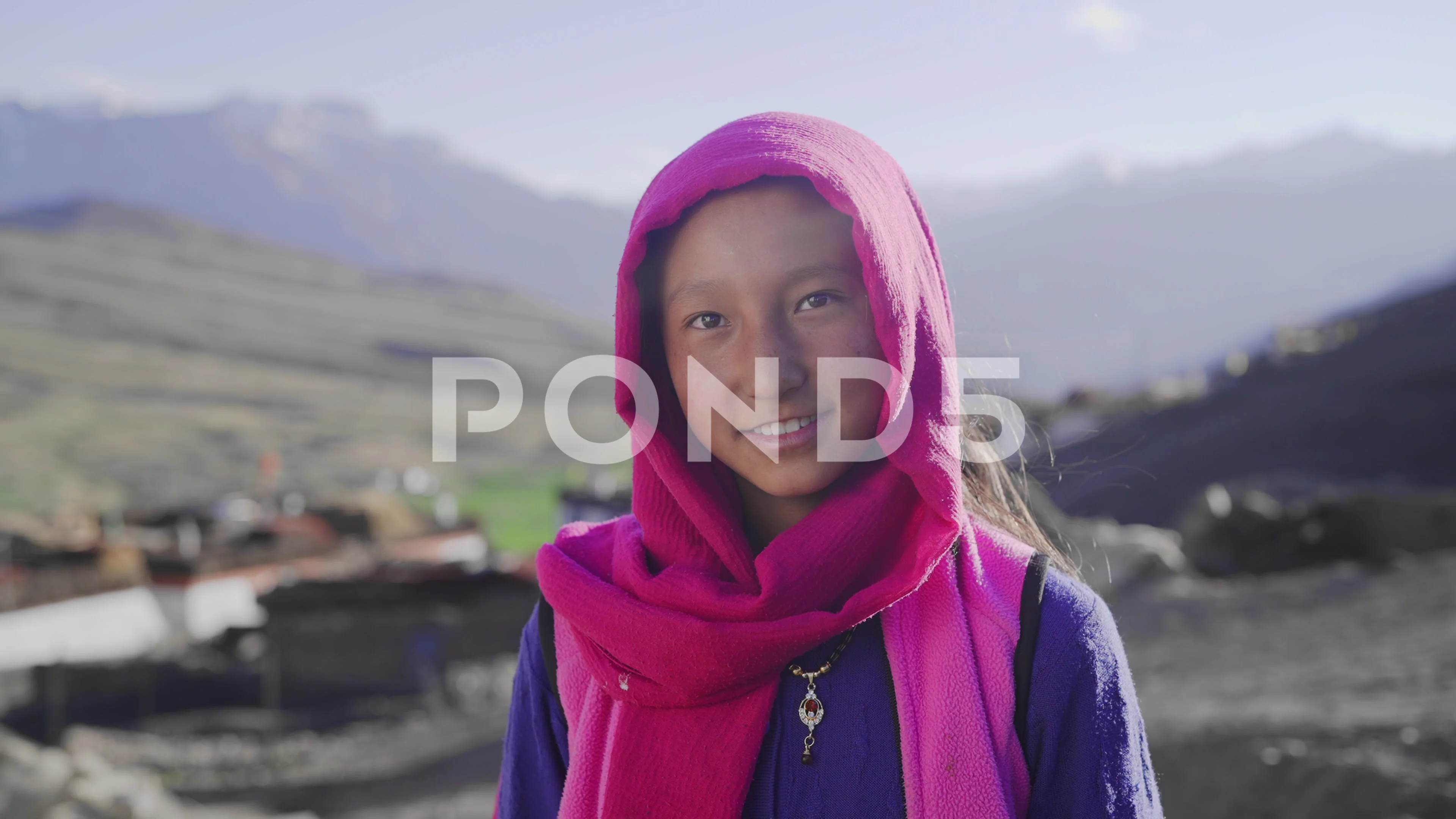 young rural Asian cute girl standing against morning sunlight