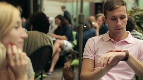 Young sad bored man on date in cafe HD Video stock 11883924