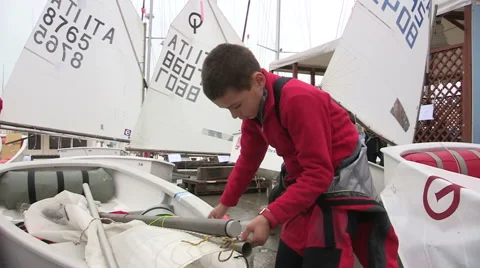 The young sailor boy mounted the sail Stock Footage 61099205