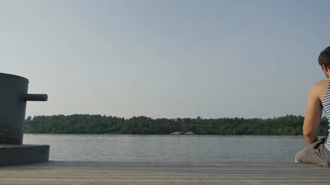 Young Sailor Resting on the Pier Stock Footage 89448252