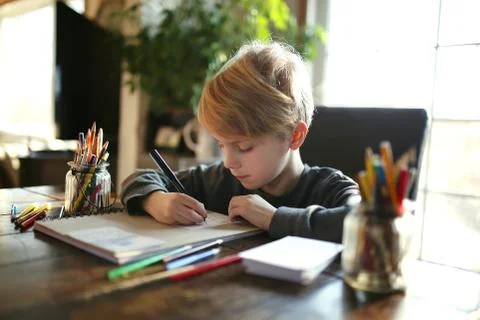 Young School Aged Child Working on Coloring Art Project Stock Photos