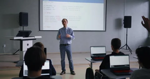 Young School Students Learning In Computer Science Classes, Middle-Aged Teacher Stock Footage 283297470