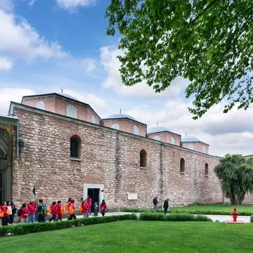 Young school students visiting the Treasury Weapons Museum at the courtyard of Stock Photos