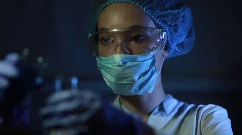 Young scientist conducting an experiment Stock Footage 67399306