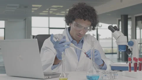 Young scientist is disappointed with the result of the microscope research. Stock Footage 137922184
