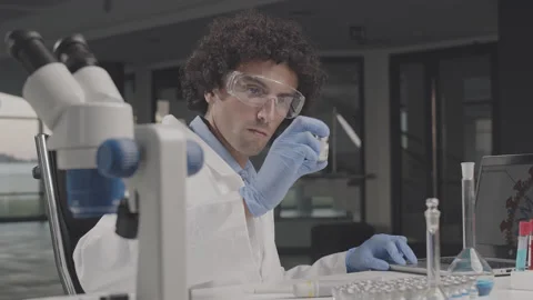 Young scientist doing some corona vaccine research in the laboratory. Stock Footage 137912216