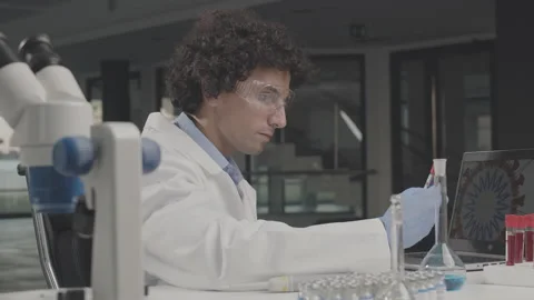 Young scientist doing some coronavirus research in the laboratory. Stock Footage 137906288