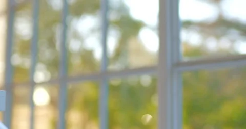 Young scientist examines a sample through a microscope. Stock Footage 88372061